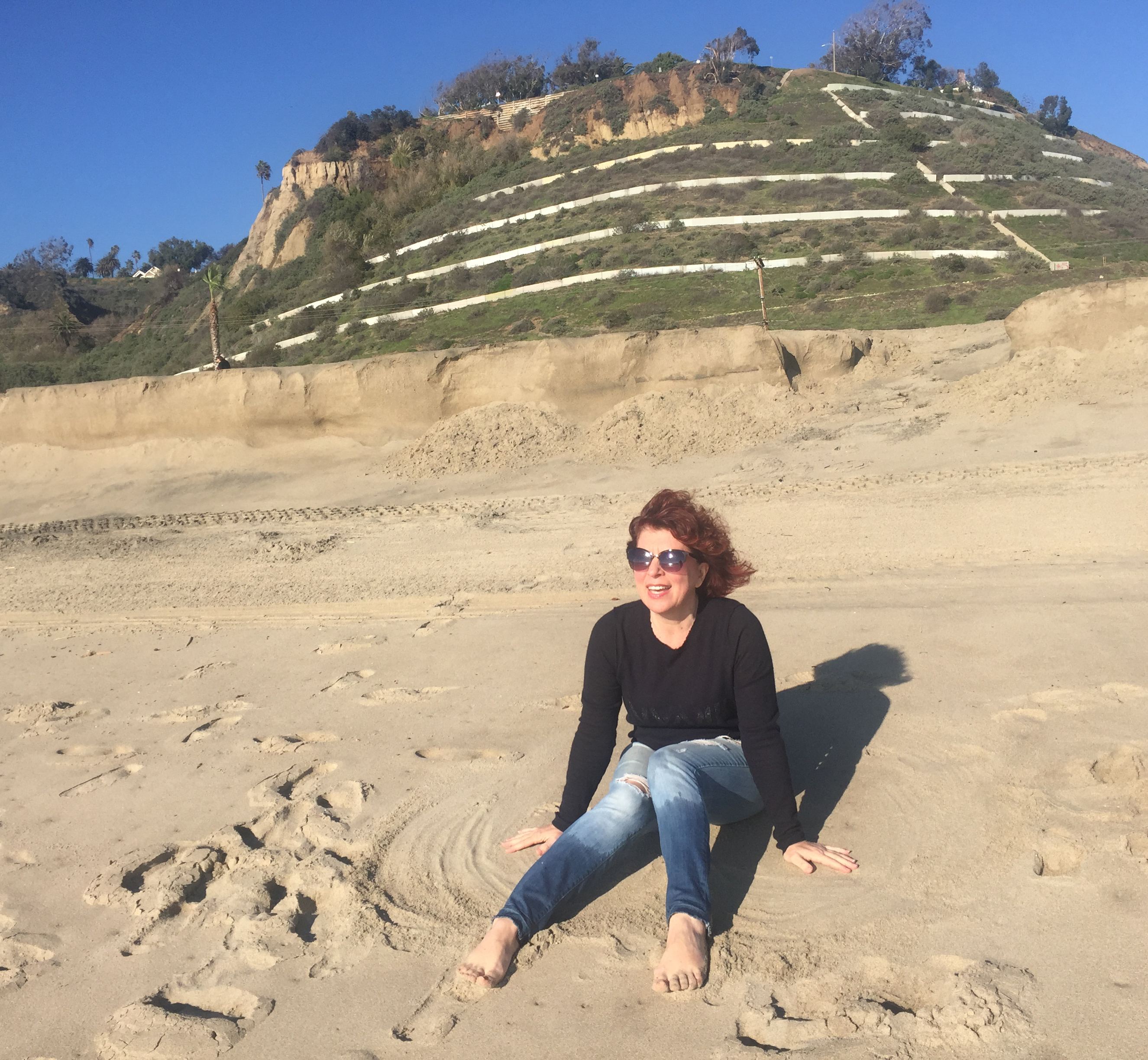 Abstract artist Clara Berta on the beach in Malibu