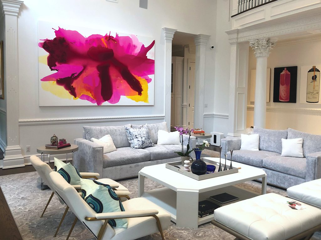 Custom commissioned pink and yellow abstract painting by artist Clara Berta installed into an art collector's modern home living room