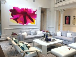 Custom commissioned pink and yellow abstract painting by artist Clara Berta installed into an art collector's modern home living room