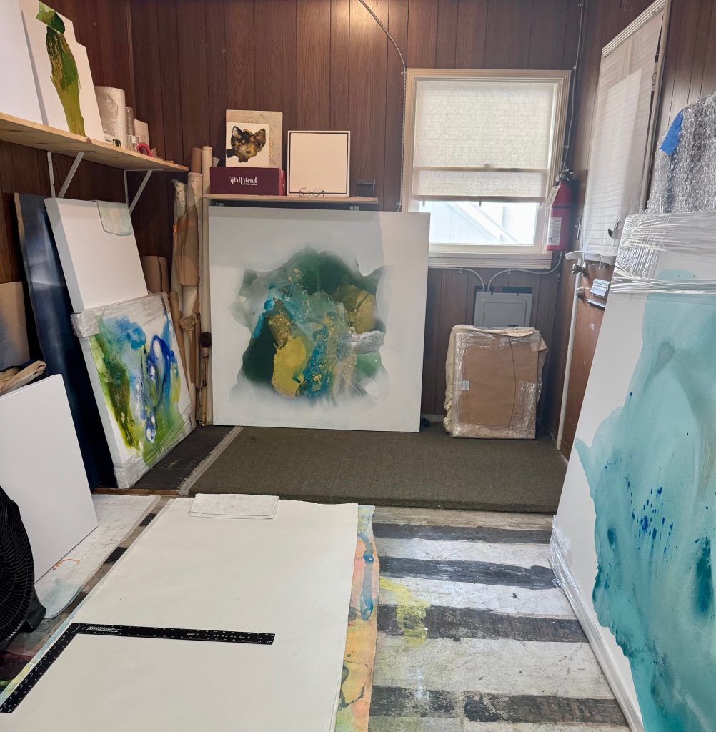 The organized artist studio of Clara Berta in California, showing a minimalist environment. A clean, functional workspace provides the clear space for abstract art to be created.