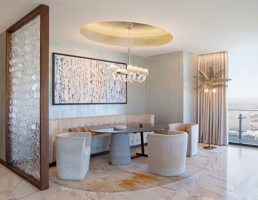 Mixed media commissioned art by Clara Berta for the Cosmopolitan Hotel. This textured installation features layered colors and shows how a clear space for abstract art enhances luxury design.