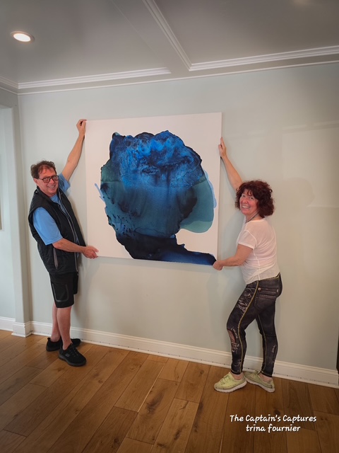 Installation view of 'Portrait in Blue' in a bright, coastal-inspired La Jolla residence. The painting’s cool blue tones and fluid textures complement the airy interior design and natural light of the space.