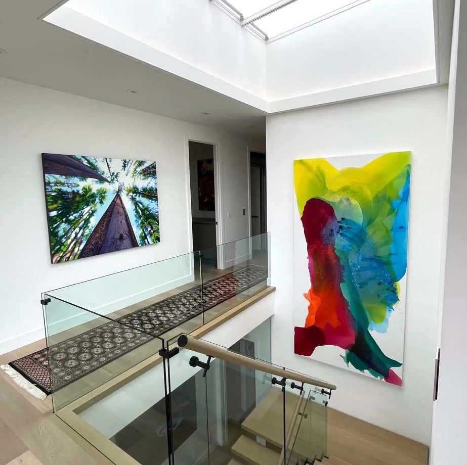 Massive 10-foot wide abstract. Vibrant, flowing pigments merge in a seamless, glass-like finish. The composition is energetic and panoramic, suggesting liquid motion across the expansive canvas.