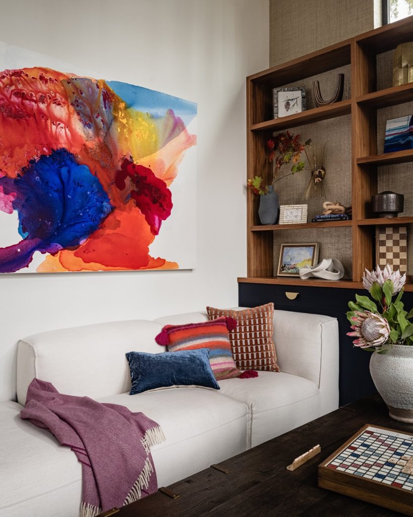 A 48x72-inch abstract acrylic canvas titled Dreamy Color, characterized by ethereal color washes and visible, gestural brushwork that adds depth to a contemporary residential interior.