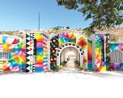 The colorful outdoor festival grounds of Laguna Art-A-Fair, showcasing fine art displays, booths, and beautiful landscaping nestled in Laguna Canyon.