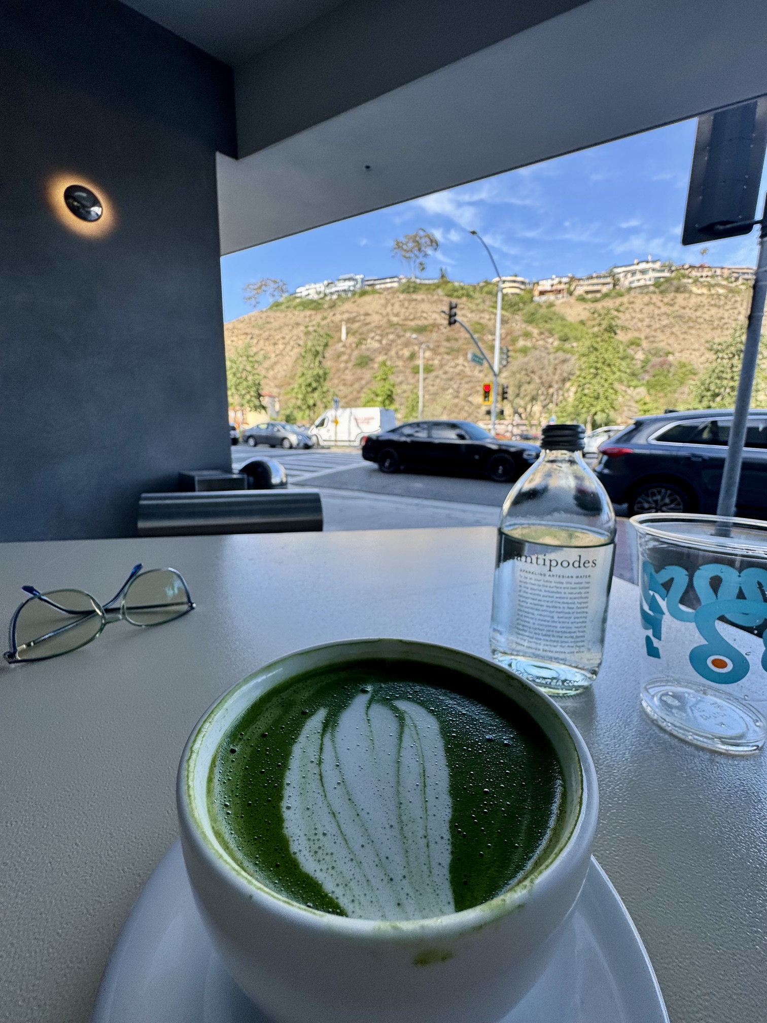 https://www.yelp.com/biz/play-laguna-beach The modern exterior of Play Coffee in Laguna Beach, featuring its sleek architectural design and outdoor seating, perfect for a mindful weekend morning.