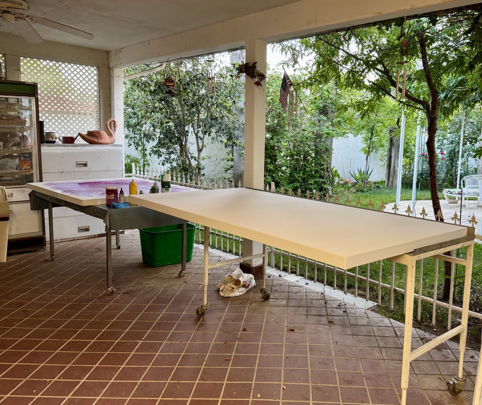 Clara Berta's outdoor patio studio setup highlighting a bright creative process space for abstract art.