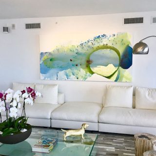 'Serenity' painting by Clara Berta, 48 x 96 in, installed in a collector's home. Blue and green flowing abstract painting by artist Clara Berta installed into an art collector's modern interior living room.