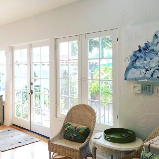 'Layers of Blue' painting by Clara Berta, installed in a collector's home in Santa Monica, CA. Minimalist blue flowing abstract painting by artist Clara Berta installed into an art collector's modern interior home