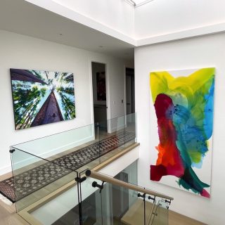 Commissioned abstract painting by Clara Berta for collector in Alberta, Canada. Calgary My Love, acrylic on canvas, 60 x 100 in. Custom commissioned colorful abstract painting by artist Clara Berta installed into an art collector's home hallway