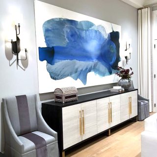 'Deep Seas' painting by Clara Berta, 60 x 115 in, installed in a collector's dining room. Blue flowing abstract painting by artist Clara Berta installed into an art collector's modern interior home