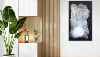 Large original minimalist modern abstract art piece Winter in White by Clara Berta, the Queen of Texture, displayed on a white wall in a modern Zen living room with natural light, vertical light-wood slats, and a large green potted plant.